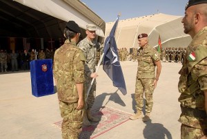 Lt. General Rodriguez, IJC Commander, passes the NATO flag during an Italian change of command